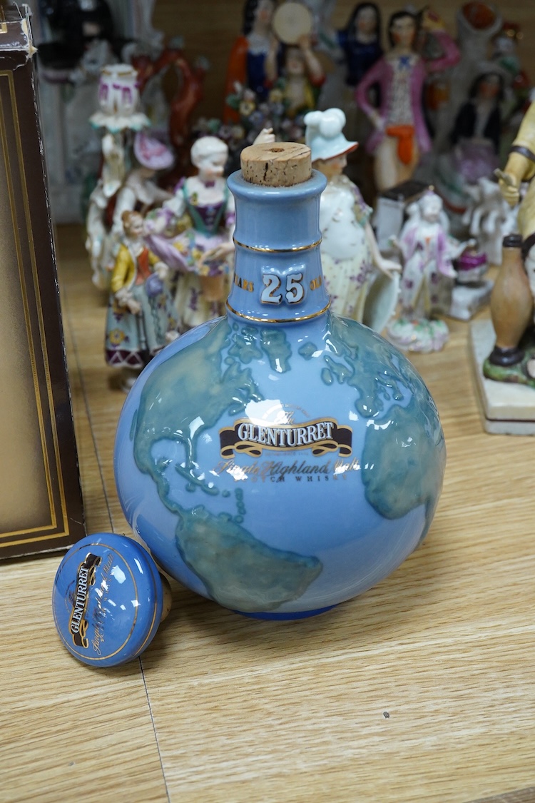 A boxed bottle of Glenturret single highland malt whisky, housed in a globe decanter